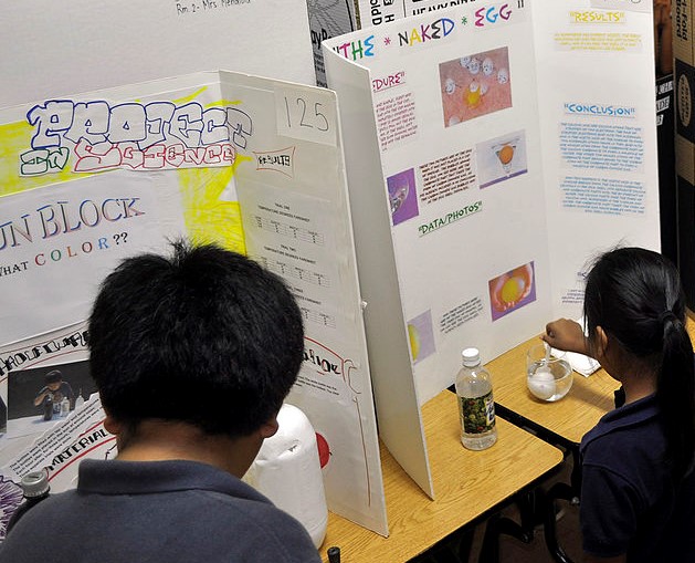 Students presenting science project at science fair