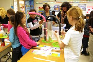 female students working on science project